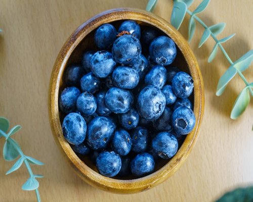 Healthy fresh food bowl on wooden table
